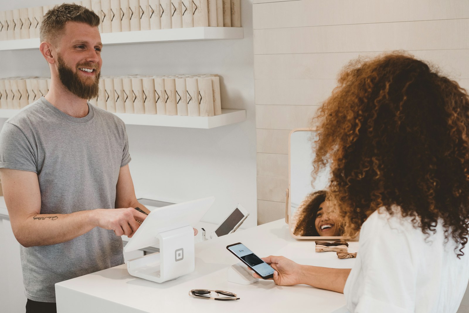 Wallet and credit cards on a counter during a purchase