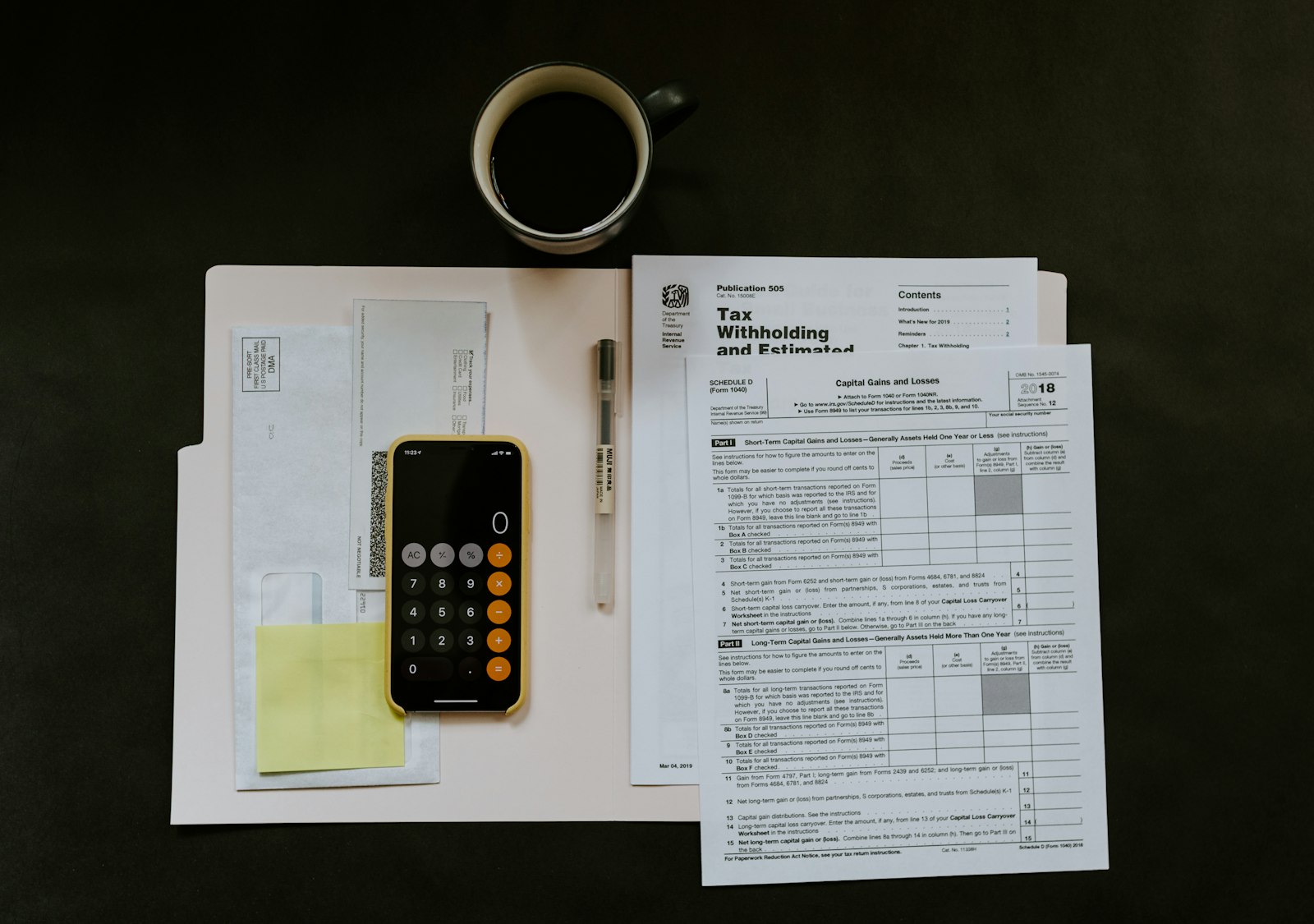 Handwritten budget notes and a calculator for debt payments