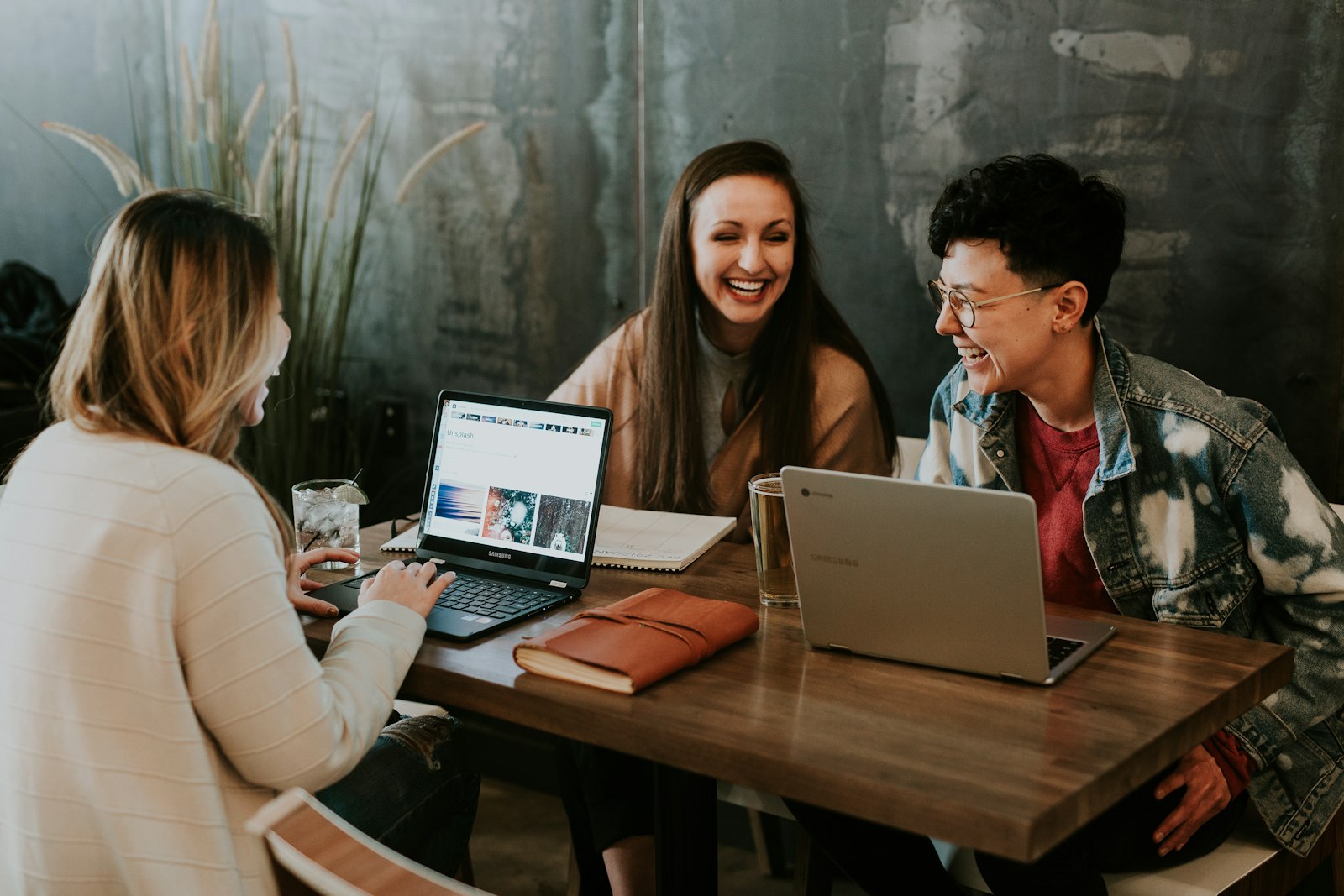 People working together at a table on a small project